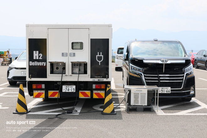 スーパーGTと自動車会議所が第4戦富士のパドックで水素による給電実験を実施。トラックを活用し水素燃料を増量